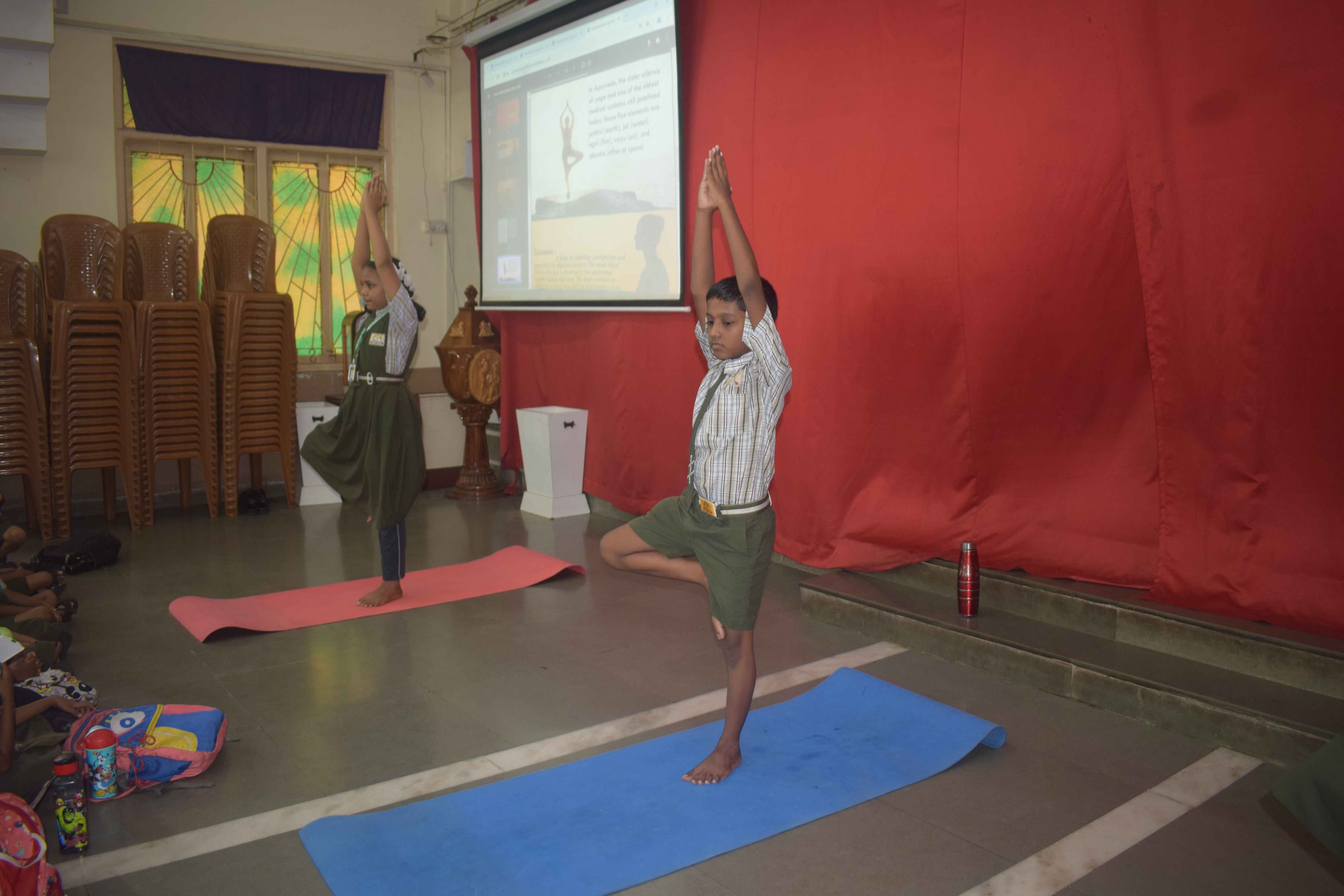 Students in tree pose